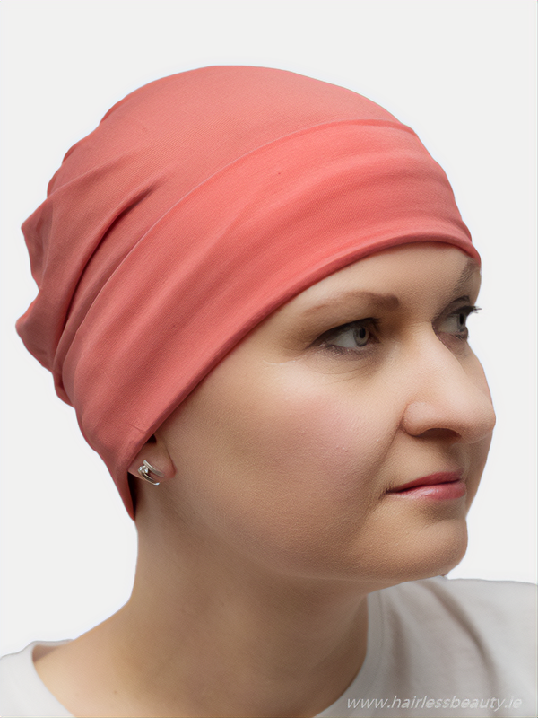 Comfortable, peach cotton sleep cap for cancer patients, perfect for sensitive scalps