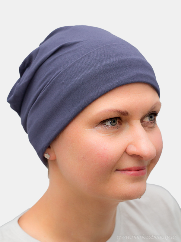 Soft and thin navy bamboo sleep cap, offering lightweight coverage for chemo patients