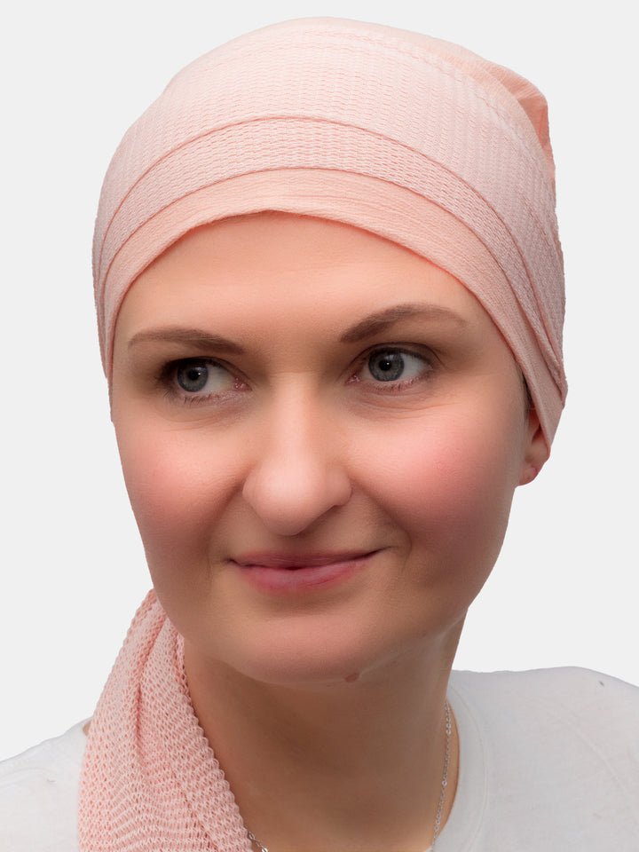 Soft peach cotton scarf providing both comfort and style for cancer patients